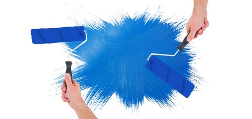 Poster - Composite image of handyman holding paint roller