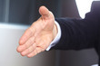 © fox17 - Businessman extending hand to shake