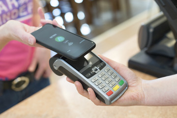 customer paying with NFC Technology