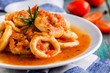 Stewed squid rings in tomato sauce