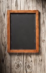 Wall Mural - old blackboard on aged wooden wall