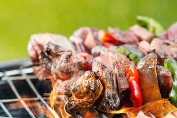 Delicious vegetable and meat skewer on grill