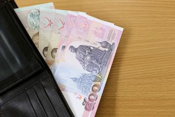 Banknotes of Thailand in wallet.