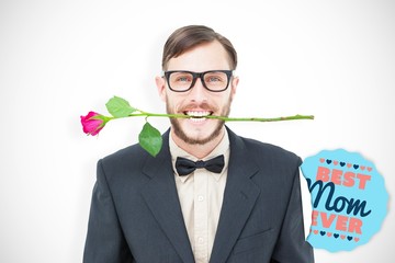 Poster - Composite image of geeky hipster holding rose between teeth