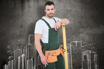 Poster - Carpenter smiling to camera with spirit level