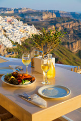 Wall Mural - Dinner for two on a sunset background