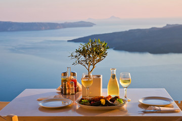 Dinner for two on a sunset background