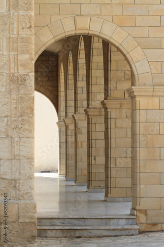 Fototapeta na wymiar Corridor with columns close up. vertical
