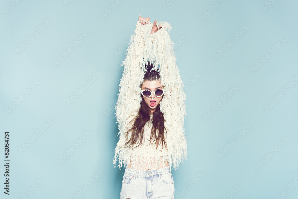 portrait of cheerful fashion hipster girl going crazy making