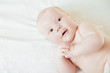 © julenochek - Newborn Baby Lying on Back looking aside