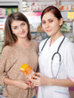 © DC Studio - Woman doctor and client inside pharmacy