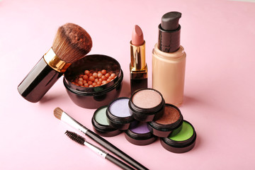 Set of decorative cosmetics on light colorful background