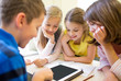 © Syda Productions - group of school kids with tablet pc in classroom