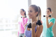 © Syda Productions - group of happy women with dumbbells in gym
