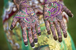 © Jihan Abdalla/Blend Images - Close up of hands with intricate henna design