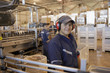 © Granger Wootz/Blend Images - Hispanic man working in bottling factory
