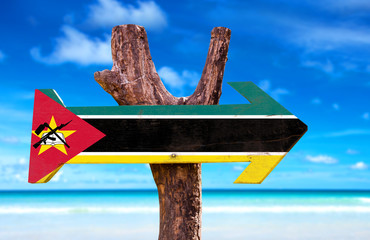 Poster - Mozambique Flag wooden sign with beach background