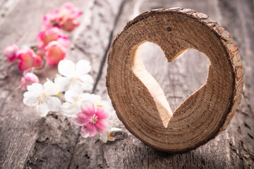 Light  heart on rustic wooden background