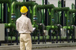© Chris Sattlberger/Blend Images - Hispanic worker wearing hard hat outdoors