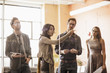 © John Fedele/Blend Images - Business people writing on glass wall