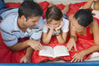 © Visual Ideas/Camilo Morales/Blend Images - Hispanic family reading