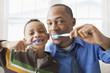 © Mike Kemp/Blend Images - Father and son brushing their teeth