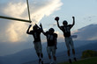 © Pete Saloutos/Blend Images - Football players cheering in game