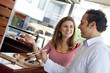© Andres Rodriguez/Blend Images - Hispanic couple eating sushi together