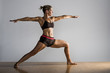 © Sollina Images/Blend Images - Caucasian woman practicing yoga in studio