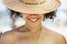 Hispanic Woman Smiling On Beach