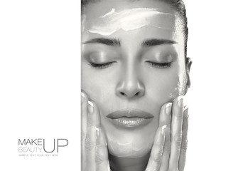 Wall Mural - skin care concept. spa woman applying moisturizer on face