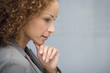 © Klaus Tiedge/Blend Images - African businesswoman resting chin on hand