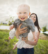 © Mike Kemp/Blend Images - Caucasian mother and baby playing outdoors