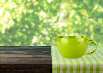 Sticker - Kitchen. Empty wooden table covered with red checked tablecloth