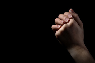 Wall Mural - Woman praying in darkness