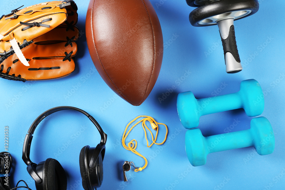 Sports equipment on color table, top view