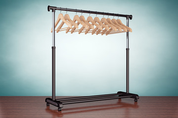 Old Style Photo. Mobile black coat rack with hangers