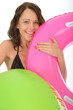 Happy Young woman On Holiday Holding Inflated Rubber Rings