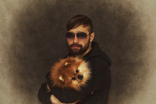 Brutal Man In Sunglasses With A Dog In Her Arms