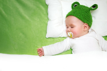 Wall Mural - Baby  on green blanket