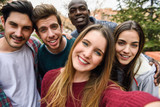 Fototapeta  - Multiracial group of friends taking selfie