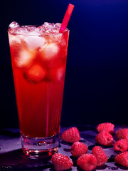 Red  raspberry cocktail  on dark background.