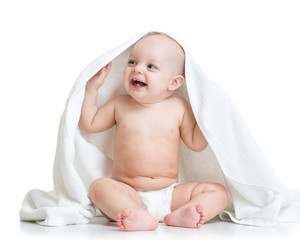 adorable happy baby boy in towel