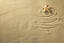 Christmass Tree From Shells On Sand Background