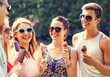 © Syda Productions - group of smiling friends with ice cream outdoors