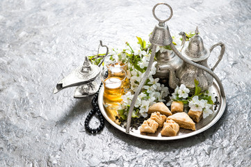 Wall Mural - Tea pot and glasses, traditional oriental delight baklava. Islam