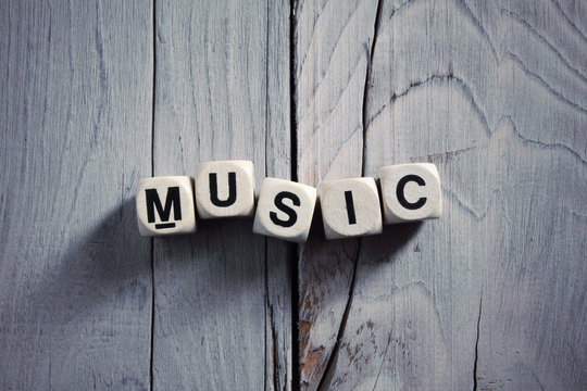 Music written on wooden blocks. Vintage style.