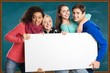 © BillionPhotos.com - Group. Group of young friends with advert board