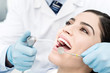 © stockyimages - Female getting her teeth examined