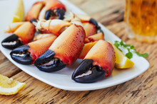 Boiled Crab Claws On A Plate And Beer